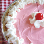Super easy to make with only 4 ingredients, this recipe for Cherry Kool Aid Pie will be the hit of your next get together!