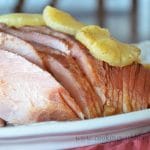 Made with cloves, pineapples, and brown sugar, this Slow Cooked Pineapple Brown Sugar Holiday Ham is guaranteed to be the star of your next holiday meal!