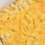 Classic Tuna Casserole in a white casserole dish topped with melted cheddar cheese.